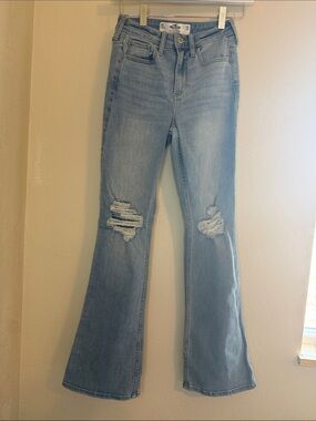 9. High-Rise Light Blue Distressed Flare Jeans - Women